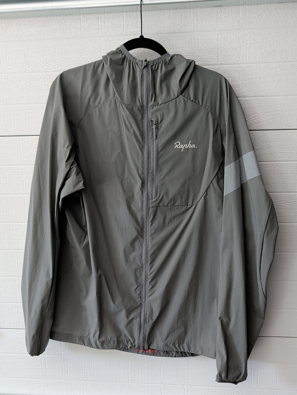 Rapha Men's Trail Lightweight Jacket in a grey color features a prominent chest
